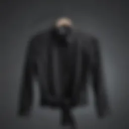 Elegant black sheer shirt draped on a minimalist hanger