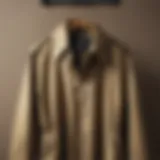 A stylish khaki windbreaker displayed on a vintage coat rack