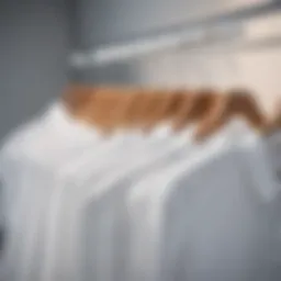 A collection of stylish white blouses displayed on hangers